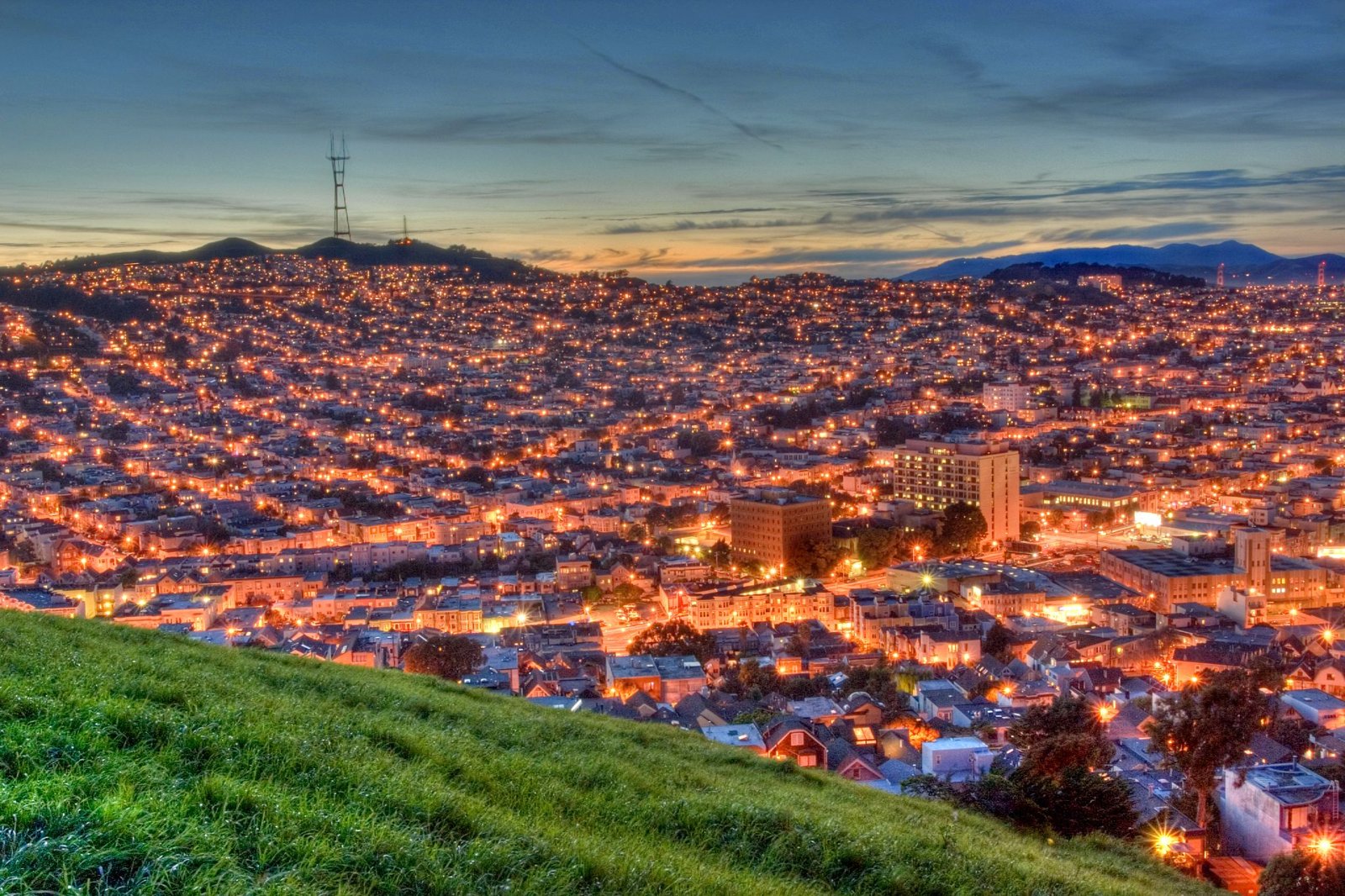 View from Bernal Hill overloooking Noe Valley. Just after sunset looking towards Sutro Tower and Twin Peaks with the GG bridge off to the right.